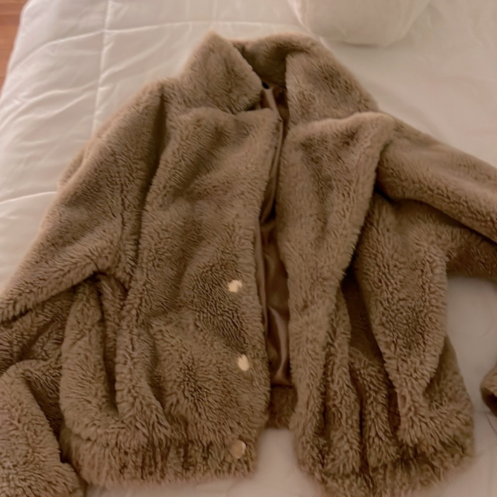 tan puffer coat with gold buttons